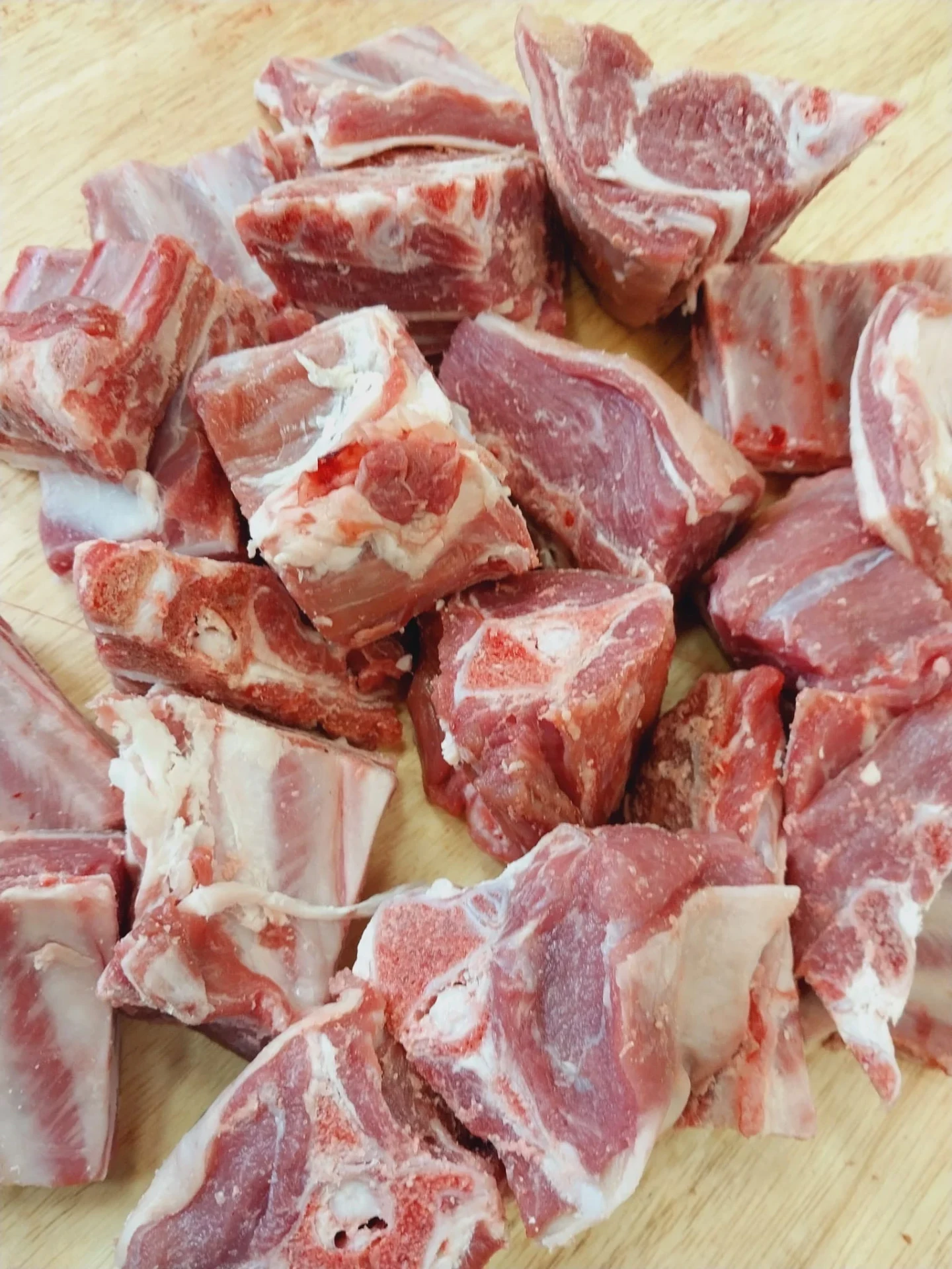 Bone-in mixed halal goat meat pieces cut for stew