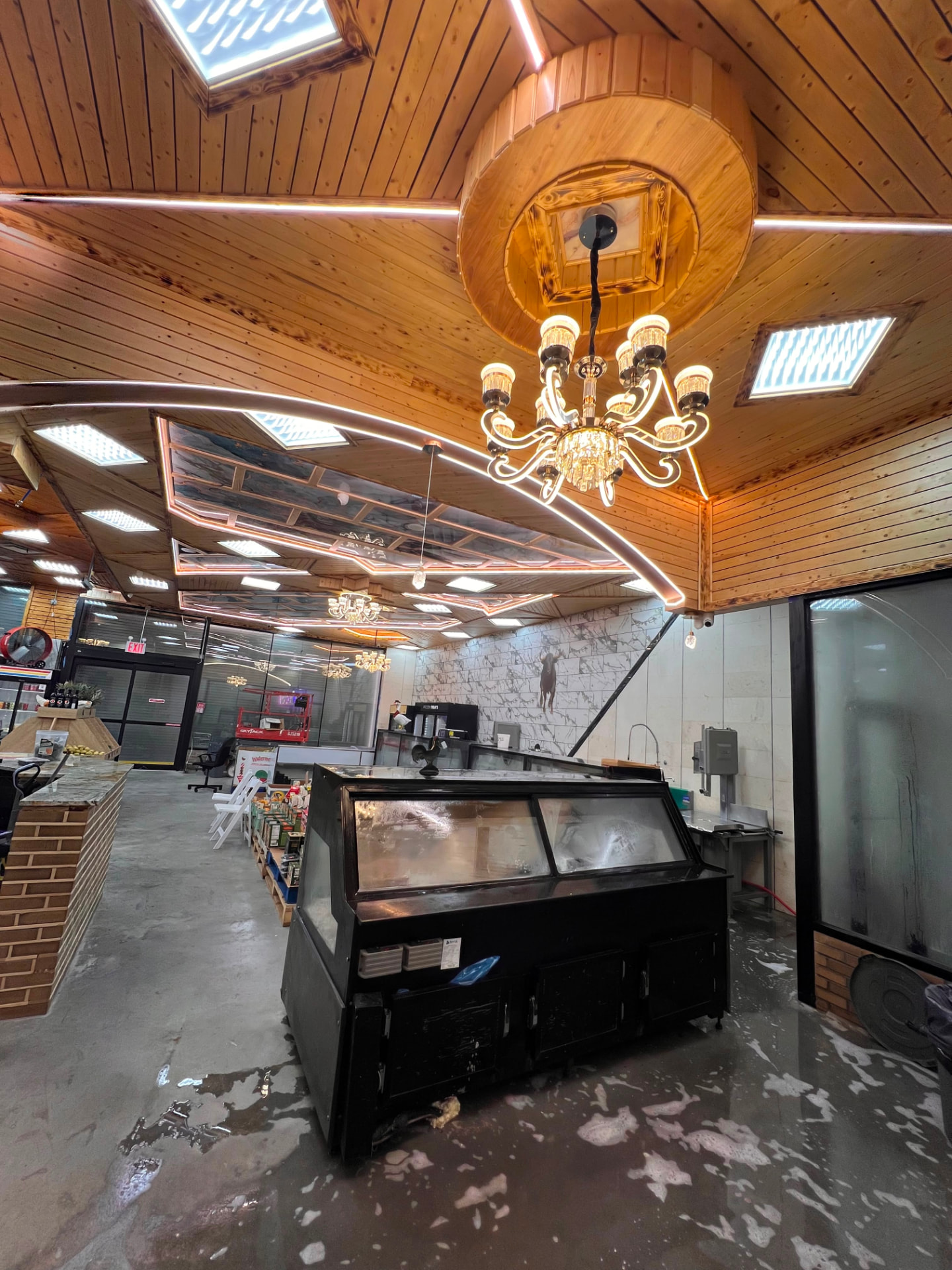 Butcher hall with custom cedar ceiling and chandeliers